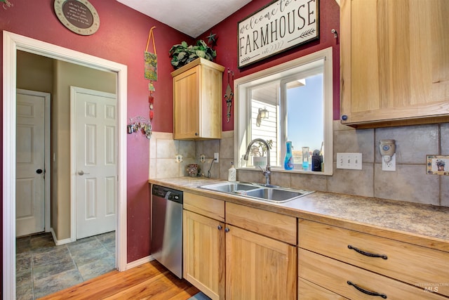 28284 Tudie Ln, Parma, ID 83660 - kitchen with light brown cabinets, tasteful backsplash, a sink, dishwasher, and baseboards
