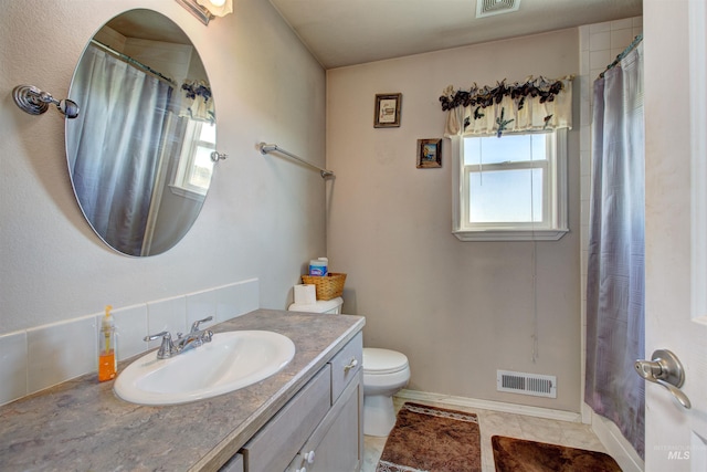 28284 Tudie Ln, Parma, ID 83660 - full bathroom with toilet, vanity, tile patterned floors, and visible vents