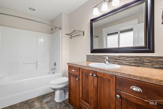 bathroom with tasteful backsplash, shower / bath combination, vanity, and toilet