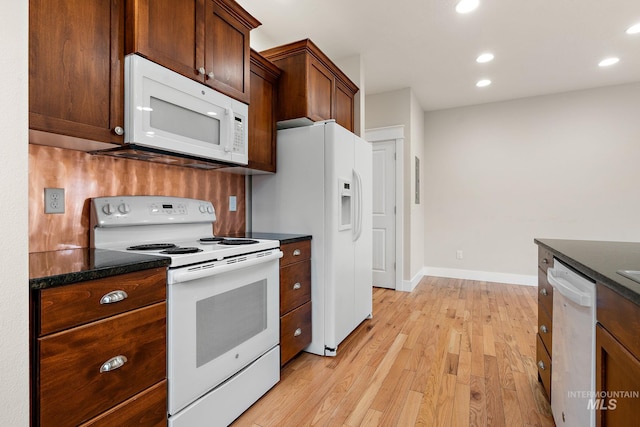 kitchen featuring baseboards, white appliances, recessed lighting, and light wood-style floors