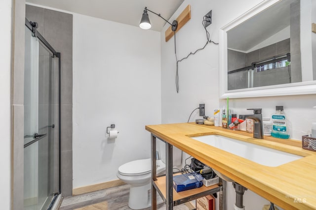 205 N Fouch, Parma, ID 83660 - bathroom with a shower stall and wood finished floors