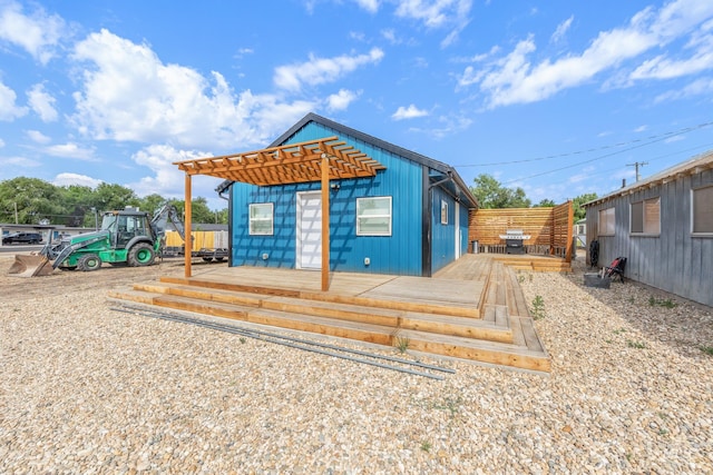 205 N Fouch, Parma, ID 83660 - rear view of house featuring a wooden deck, a pergola, and board and batten siding