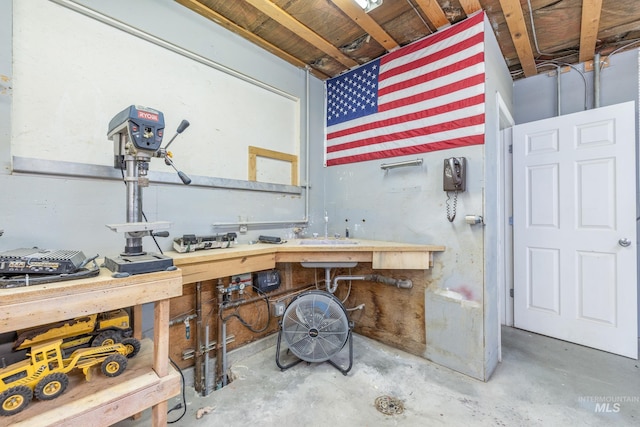 205 N Fouch, Parma, ID 83660 - misc room with a workshop area and unfinished concrete flooring