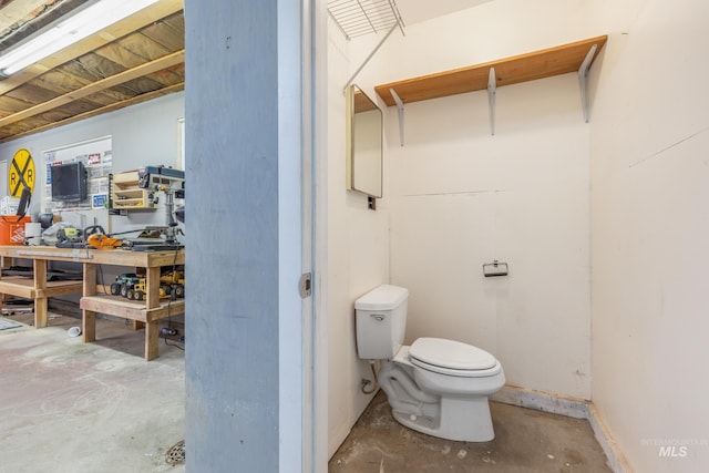 205 N Fouch, Parma, ID 83660 - bathroom with unfinished concrete floors and a workshop area