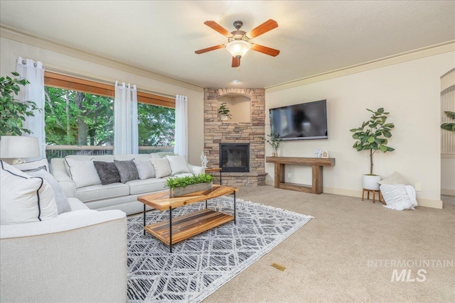 2895 E Shadowwolf Dr, Eagle, ID 83616 - living area featuring a ceiling fan, carpet flooring, a fireplace, and crown molding