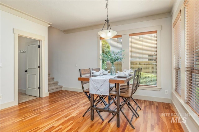 2895 E Shadowwolf Dr, Eagle, ID 83616 - dining room featuring light wood-type flooring, plenty of natural light, and stairs