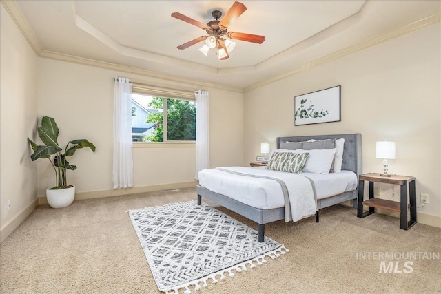 2895 E Shadowwolf Dr, Eagle, ID 83616 - bedroom featuring a tray ceiling, carpet, crown molding, and a ceiling fan