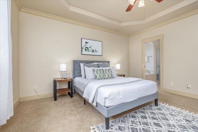 2895 E Shadowwolf Dr, Eagle, ID 83616 - bedroom with light colored carpet, a tray ceiling, crown molding, connected bathroom, and ceiling fan