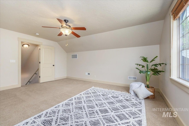 2895 E Shadowwolf Dr, Eagle, ID 83616 - bonus room with light carpet, vaulted ceiling, a ceiling fan, and a textured ceiling