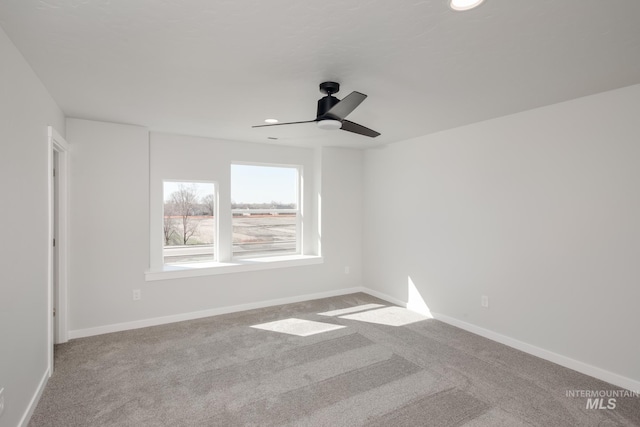 empty room with light carpet, ceiling fan, baseboards, and recessed lighting