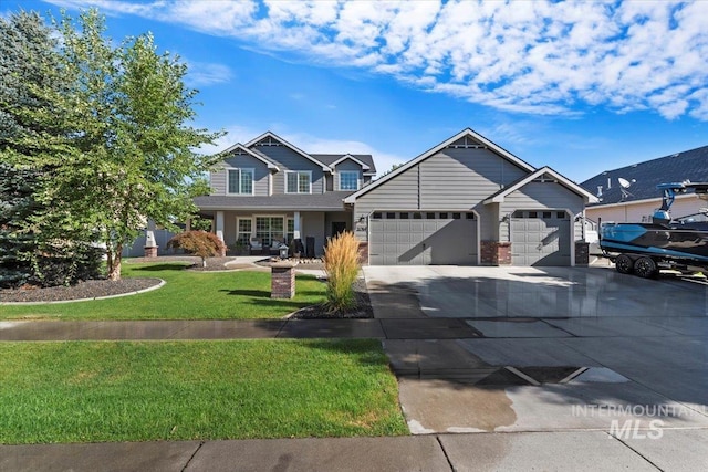 craftsman-style house with a garage and a front lawn