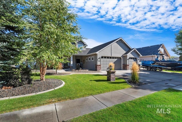 view of front of house featuring a front yard and a garage