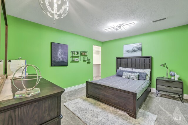 930 W Wanda Ln, Heyburn, ID 83336 - bedroom featuring carpet, baseboards, and a textured ceiling