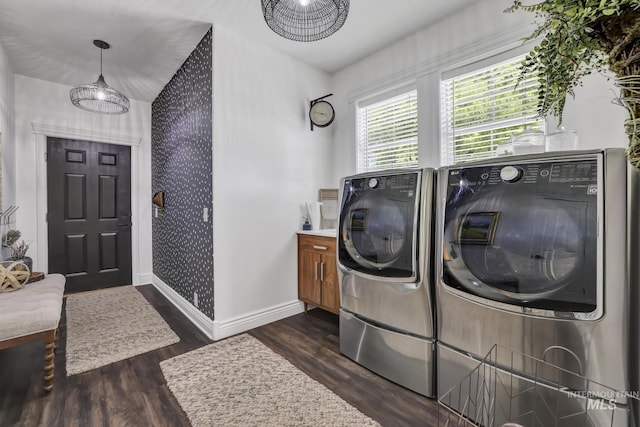 930 W Wanda Ln, Heyburn, ID 83336 - washroom featuring separate washer and dryer, baseboards, dark wood finished floors, cabinet space, and wallpapered walls