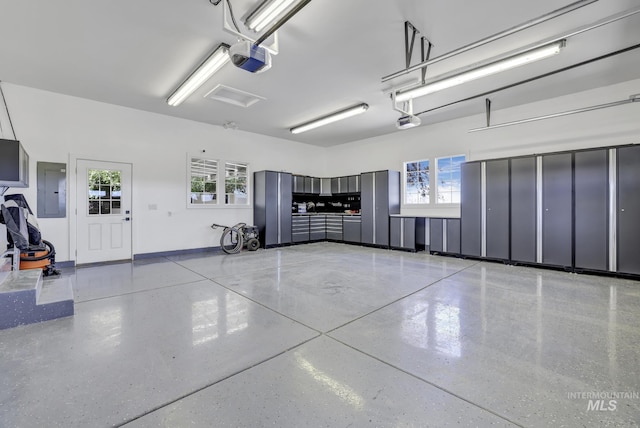 930 W Wanda Ln, Heyburn, ID 83336 - garage featuring electric panel and a garage door opener