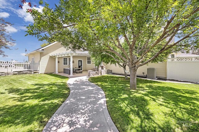 930 W Wanda Ln, Heyburn, ID 83336 - view of front of property featuring a pergola, a patio, and central AC