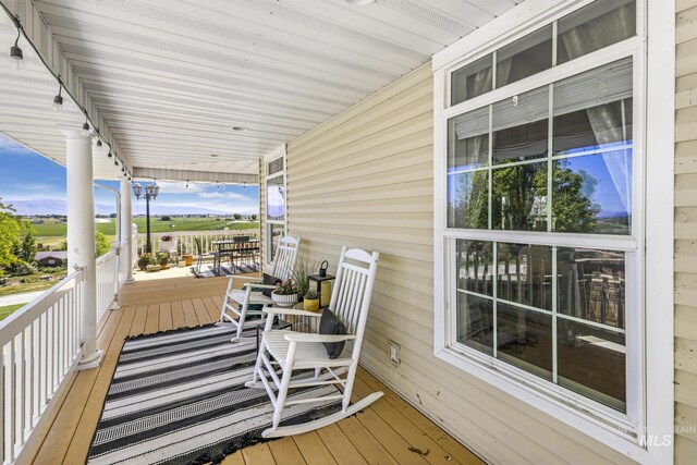 930 W Wanda Ln, Heyburn, ID 83336 - deck featuring covered porch and a mountain view