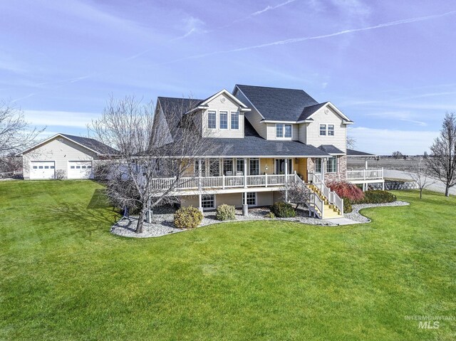 930 W Wanda Ln, Heyburn, ID 83336 - rear view of house featuring stairway, a porch, and a lawn