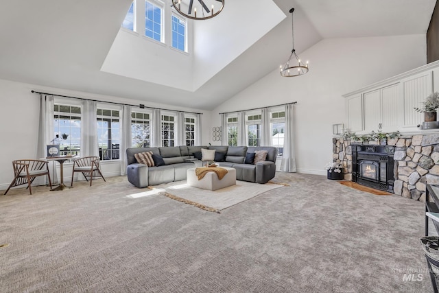 930 W Wanda Ln, Heyburn, ID 83336 - living room with a chandelier, high vaulted ceiling, plenty of natural light, carpet, and baseboards