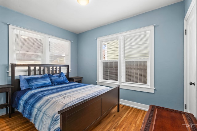 bedroom with hardwood / wood-style floors