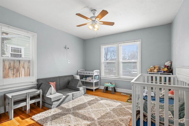 bedroom featuring wood-type flooring and ceiling fan