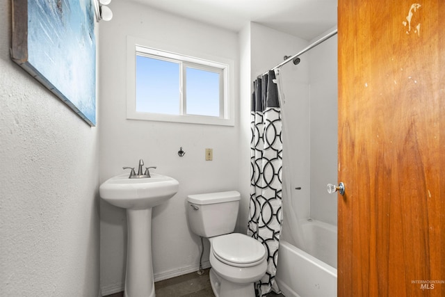 full bathroom with shower / tub combo with curtain, toilet, and sink