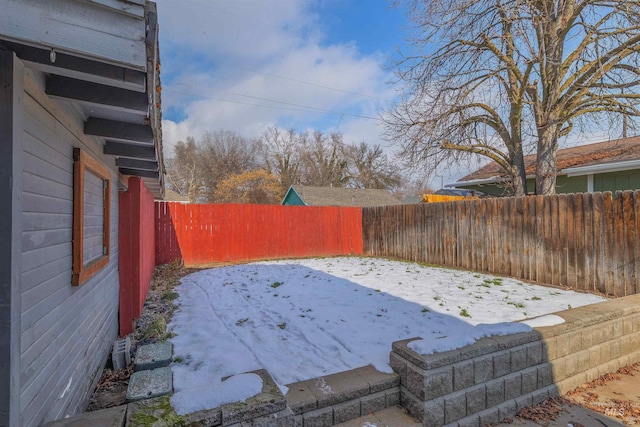 view of yard layered in snow