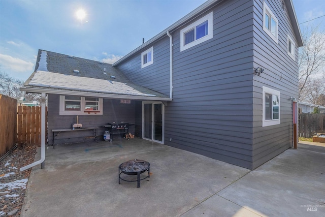 back of house featuring a patio area and an outdoor fire pit