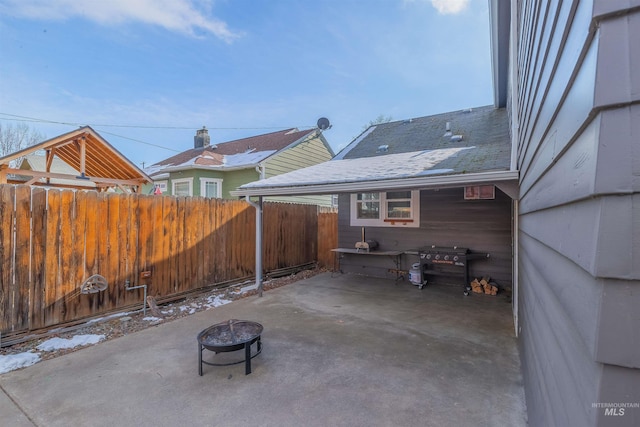 view of patio featuring grilling area and an outdoor fire pit