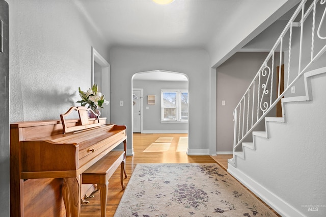 entryway with hardwood / wood-style floors