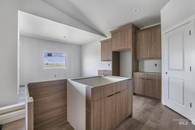 916 23rd Ave E, Jerome, ID 83328 - kitchen with vaulted ceiling, wood finished floors, modern cabinets, a kitchen island, and recessed lighting