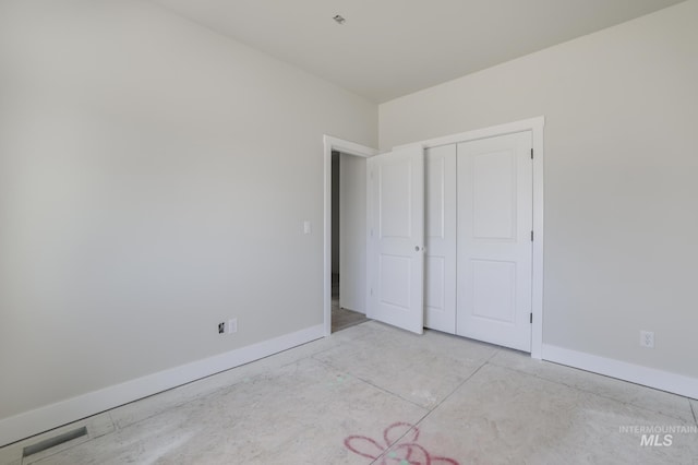 916 23rd Ave E, Jerome, ID 83328 - unfurnished bedroom with baseboards and a closet