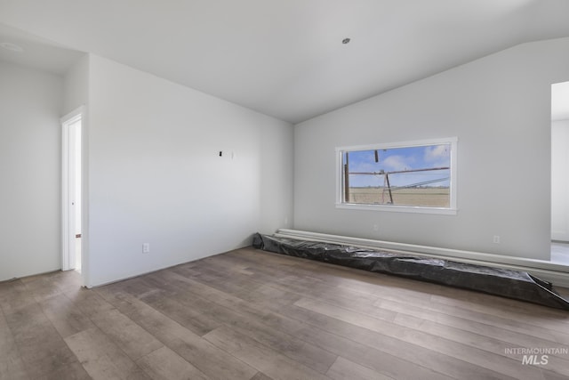 916 23rd Ave E, Jerome, ID 83328 - unfurnished room with vaulted ceiling and wood finished floors