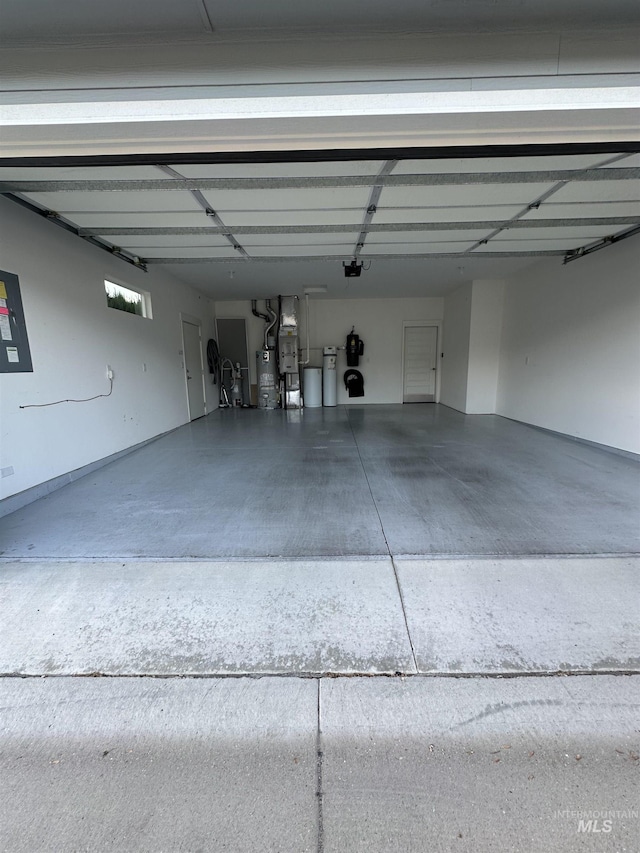 garage with water heater and heating unit