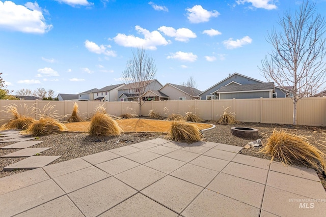 view of patio / terrace with a fire pit and a fenced backyard