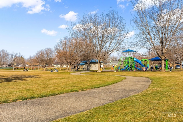 surrounding community featuring a lawn and playground community