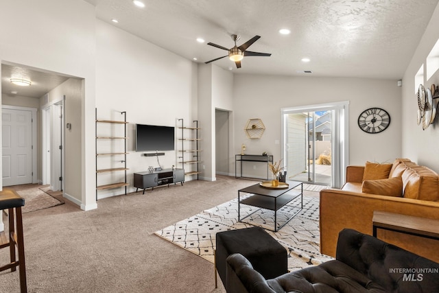 living area featuring baseboards, light colored carpet, high vaulted ceiling, recessed lighting, and a textured ceiling