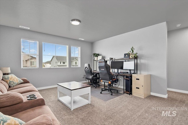 office area with visible vents, baseboards, and carpet floors