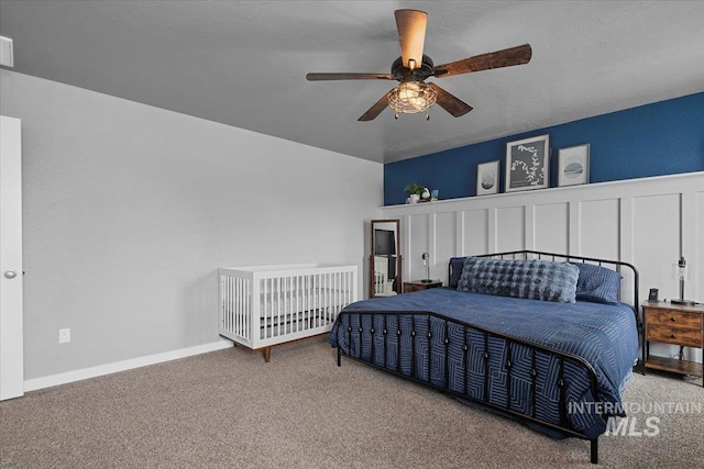 bedroom with a ceiling fan and carpet flooring