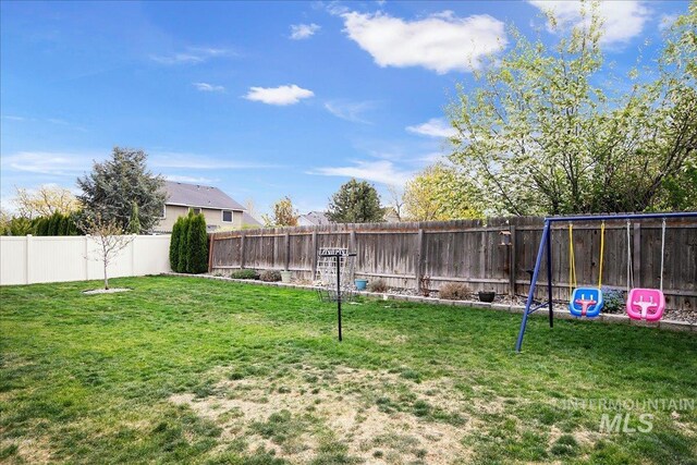 view of yard with a fenced backyard