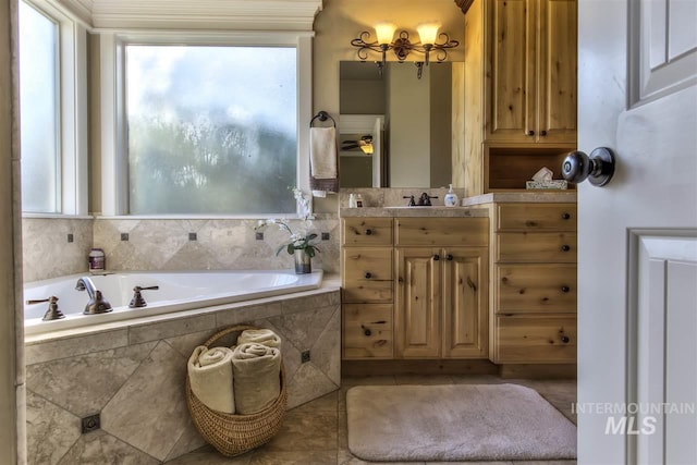 full bath featuring tile patterned floors, vanity, and a garden tub