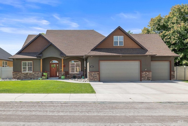 455 Coiner Cir, Twin Falls, ID 83301 - craftsman inspired home featuring stone siding, an attached garage, a shingled roof, stucco siding, and driveway