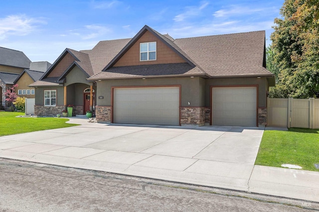 455 Coiner Cir, Twin Falls, ID 83301 - craftsman-style home with stone siding, a garage, stucco siding, and concrete driveway