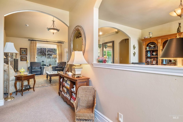 455 Coiner Cir, Twin Falls, ID 83301 - living area featuring arched walkways, carpet floors, and plenty of natural light
