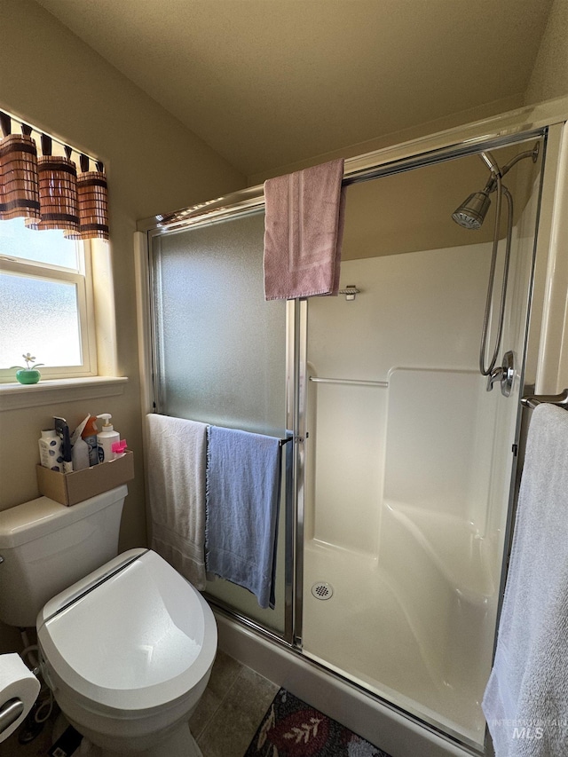 1309 Golden Pheasant Dr, Twin Falls, ID 83301 - full bath with a shower stall, toilet, and tile patterned floors