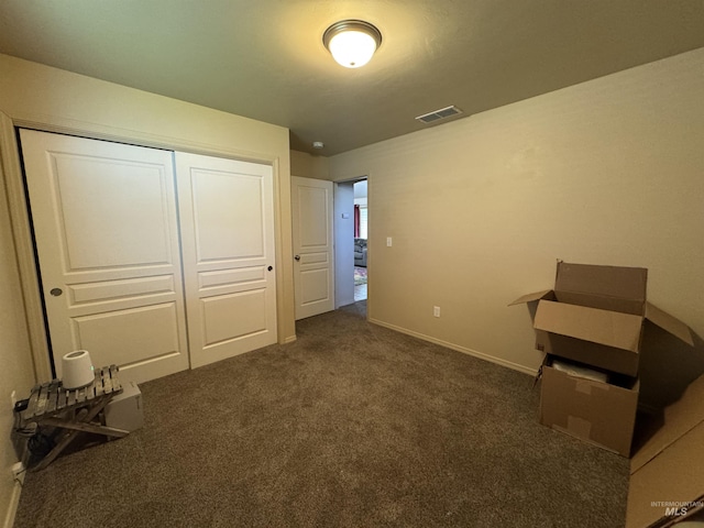 1309 Golden Pheasant Dr, Twin Falls, ID 83301 - unfurnished bedroom with a closet, dark carpet, and baseboards