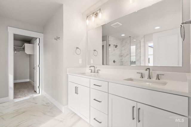 full bath with marble finish floor, a sink, a stall shower, and visible vents
