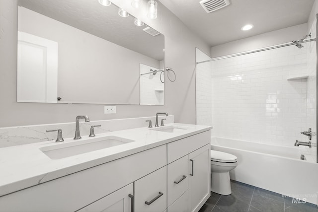 full bath featuring shower / washtub combination, visible vents, toilet, and a sink