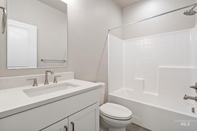 full bathroom featuring toilet, vanity, and bathing tub / shower combination