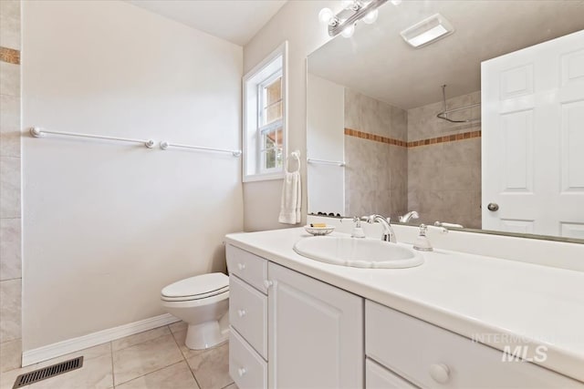 full bathroom featuring tile patterned flooring, vanity, toilet, visible vents, and tiled shower